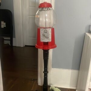 Classic Red Gumball Machine on Black Stand